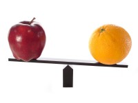 Photo of an apple and an orange on a balance