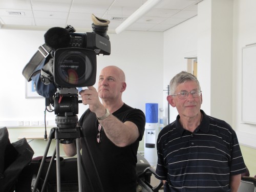 Liverpool physicist John Fry (right) gets ready for his close-up