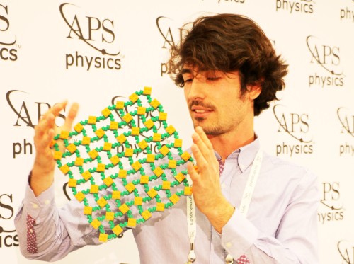 Photograph of Paolo Celli with his LEGO brick platform