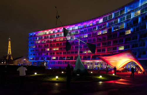 Photograph of the art installation "Light is Here" by Finnish artist Kari Kola projected onto UNESCO's Paris headquarters