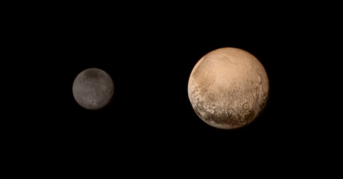 An image of Pluto (right) and its moon Charon